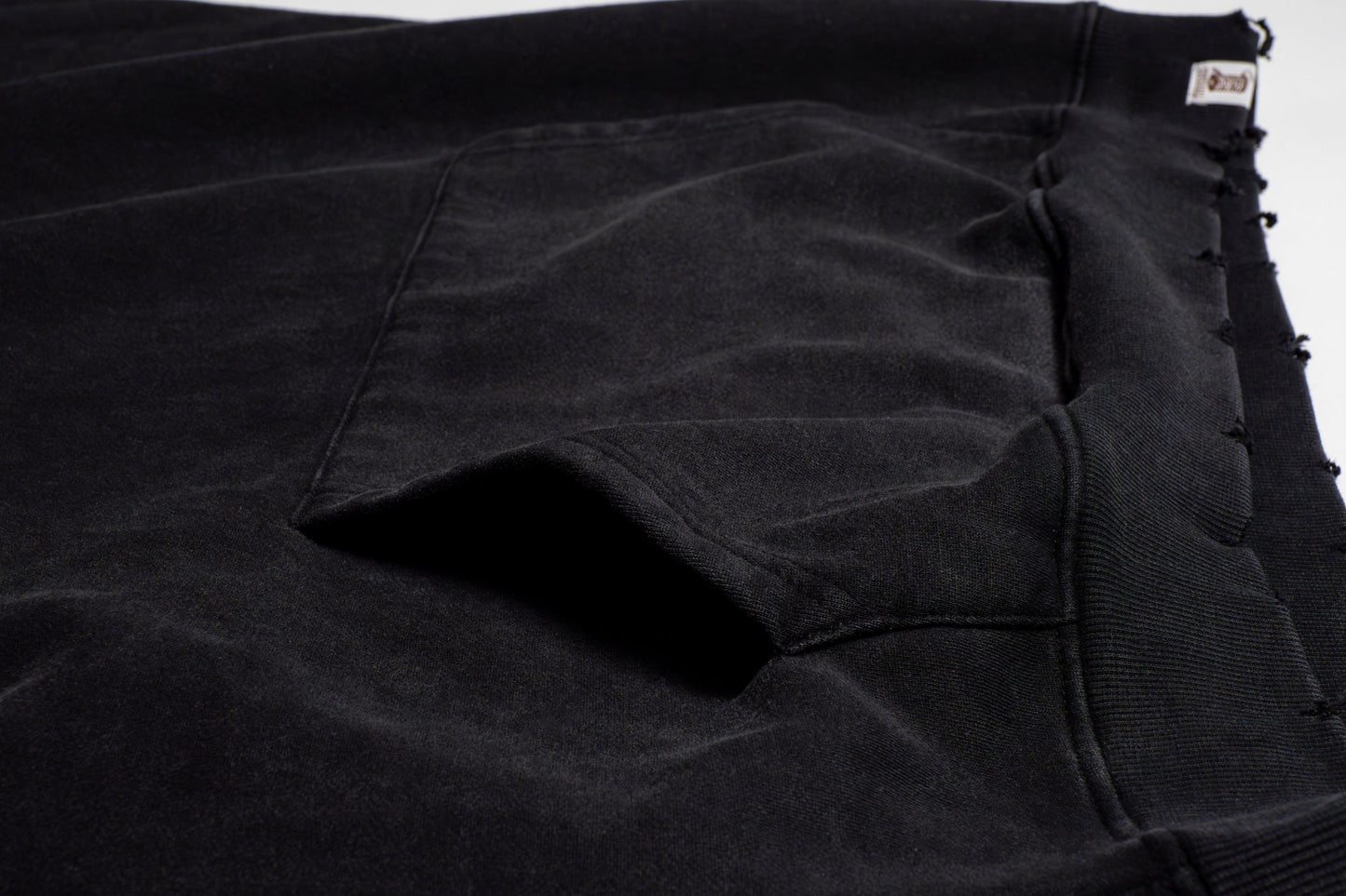 The pockets are cleanly integrated into the design, offering both functionality and flow perfect for keeping essentials close with a laid-back edge.