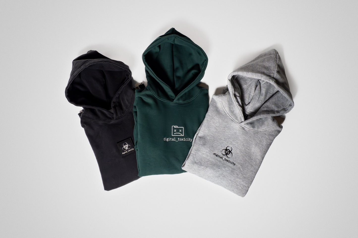 This trio of hoodies blends cozy chaos with cheesy charm from the sharp Pine Green, to the melt-in-your-heart Heathered Gray, to the edgy Charcoal Acid-Wash it’s a full platter of comfort, stitched with sass and served with style.