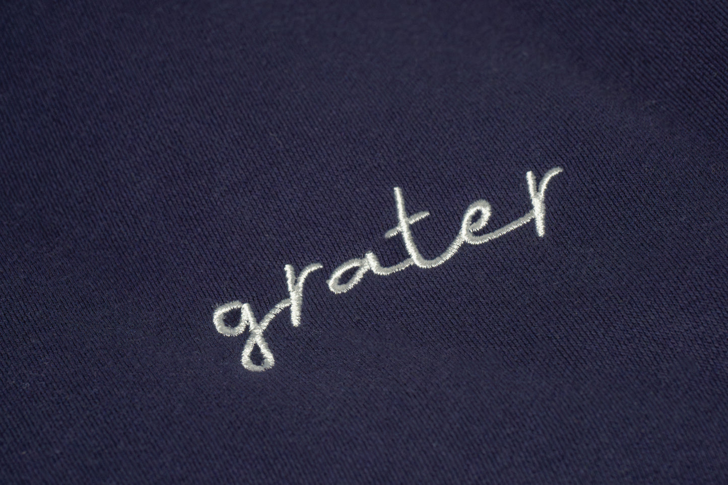 The โGraterโ logo is simple yet bold clean lettering with a playful edge, capturing the brandโs fun, pun-loving spirit in a minimal design.