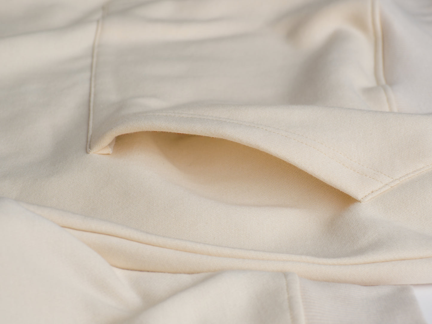Designed for ease and warmth, the hoodie features a roomy kangaroo pocket perfect for stashing your snacks or just keeping your hands toasty.