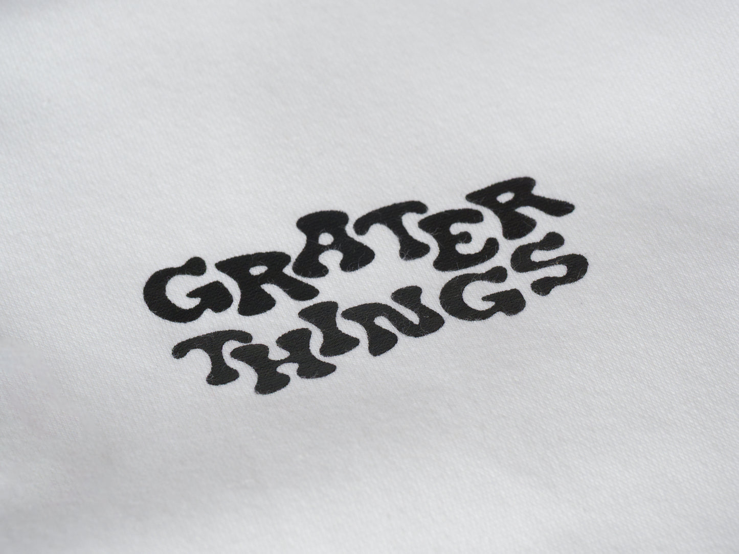 A bold bite of nostalgia this “Grater Things” logo pops with retro charm and cheesy attitude.