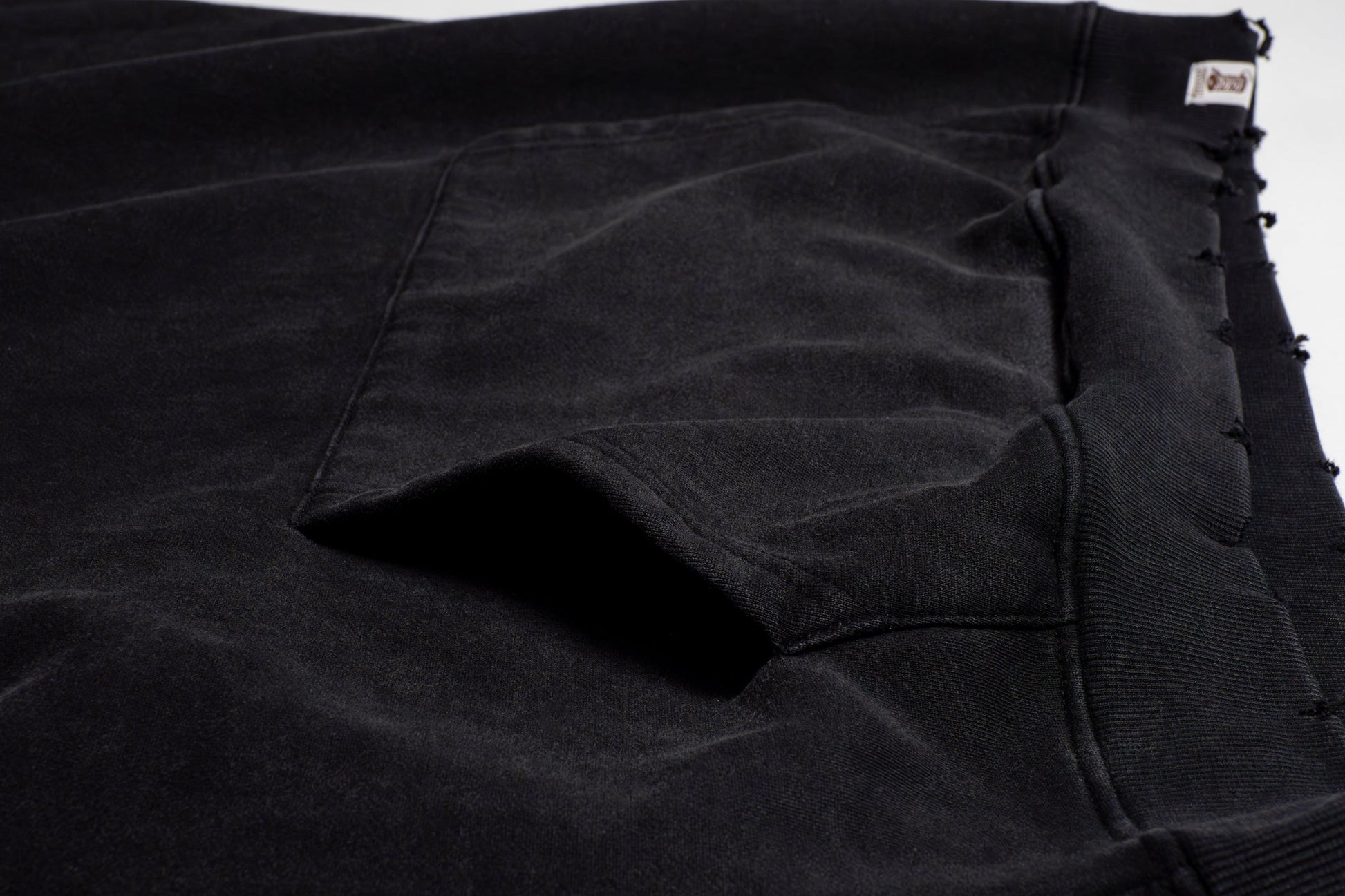 The pockets are cleanly integrated into the design, offering both functionality and flow perfect for keeping essentials close with a laid-back edge.