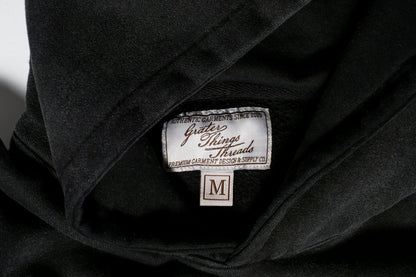 The tag reads Grater Things Threads in clean lettering, stitched neatly into the inner collar  a subtle nod to comfort, quality, and cheesy charm.